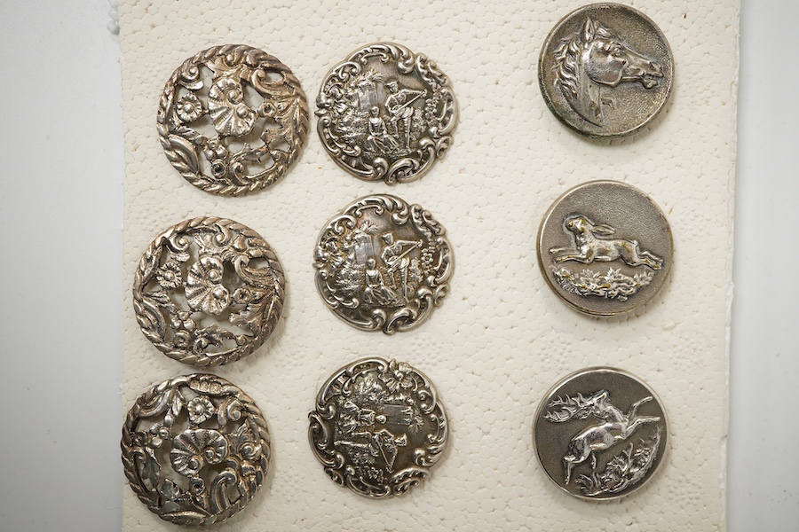 A set of 4 Edwardian cast silver buttons, decorated with a lady and gallant, Levi & Salaman, Birmingham 1901, 27mm, a set of 6 unmarked cast metal buttons decorated with flowers, 30mm and a set of 6 French Perfectionne w